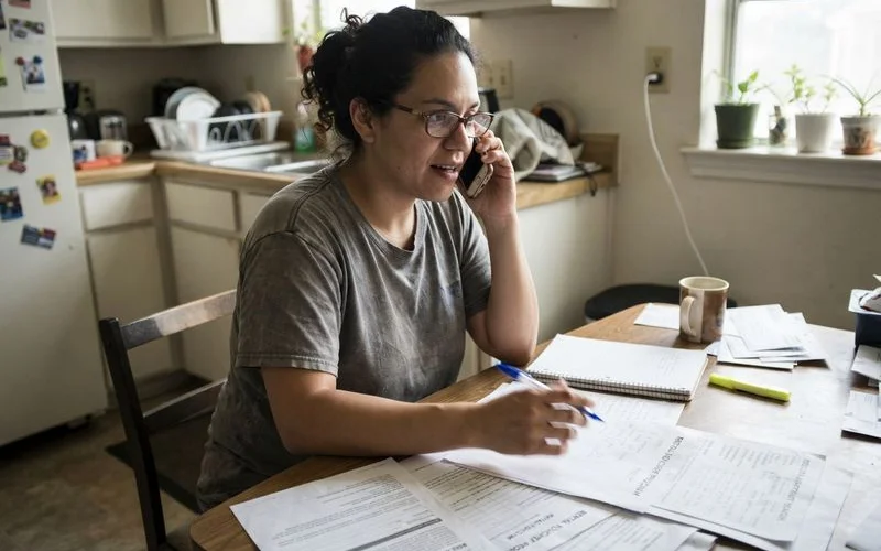 A renter with a housing voucher approval letter calling apartment communities in Houston to ask about acceptance